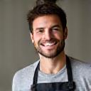Liam, a smiling barista, pouring coffee